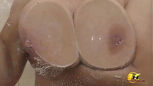Pressed my breasts against the glass and then masturbate with a load of water