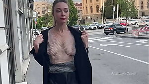 Topless walk around the city. Showing boobs to passers-by. Public.